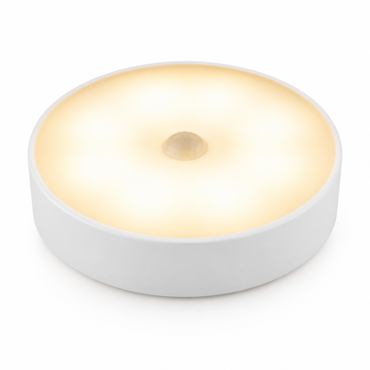 Round white sensor light on a white studio background