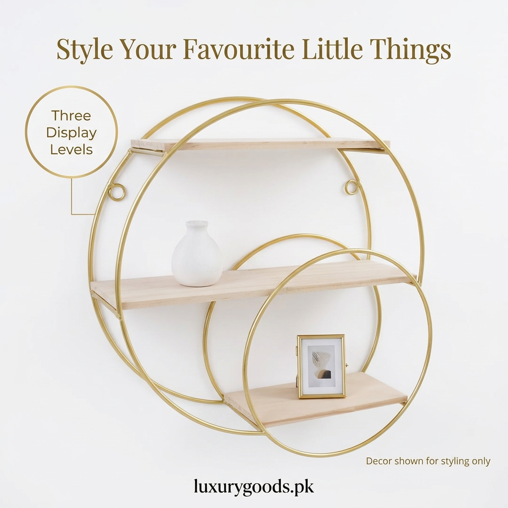 Golden round wall shelf styled with small decorative accents